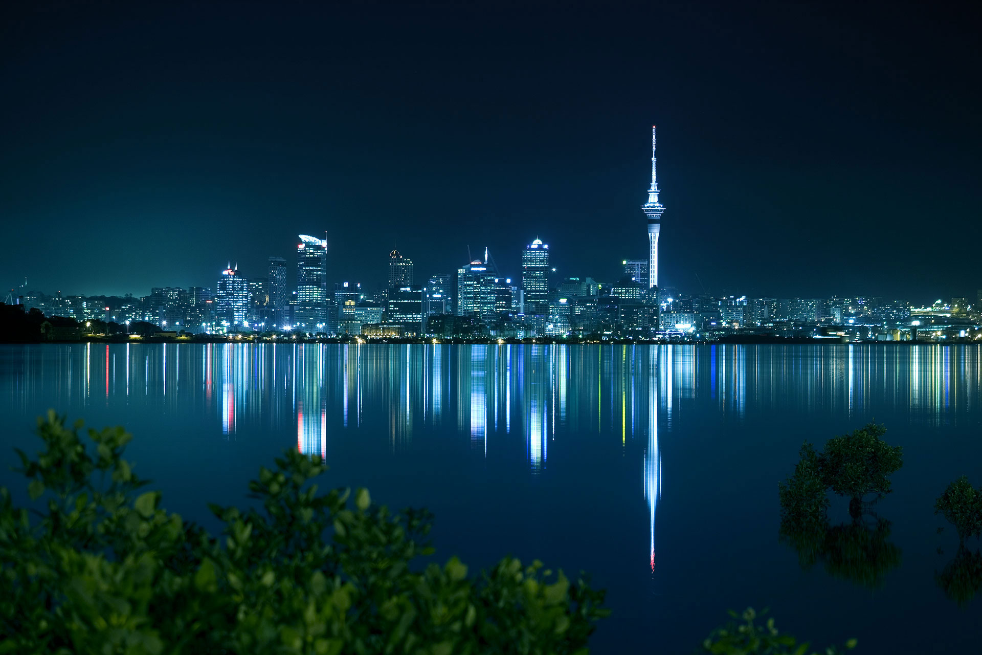 City skyline at night with reflections